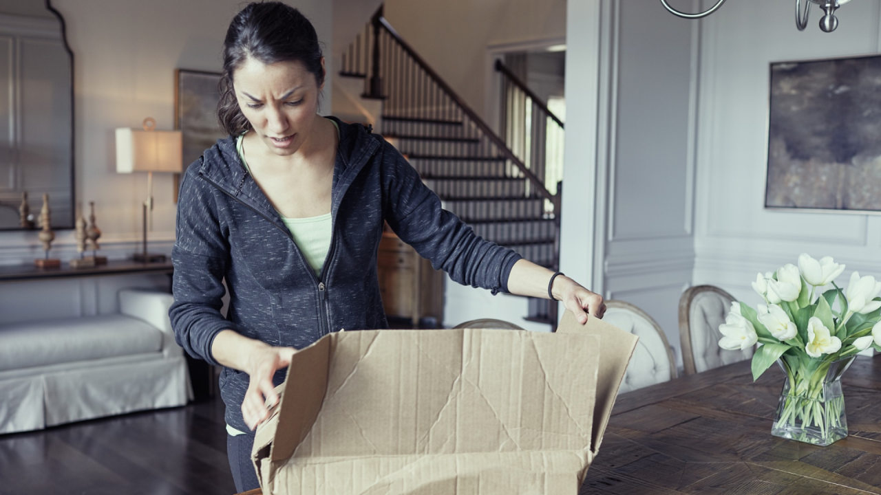 Woman Unboxing Broken Package