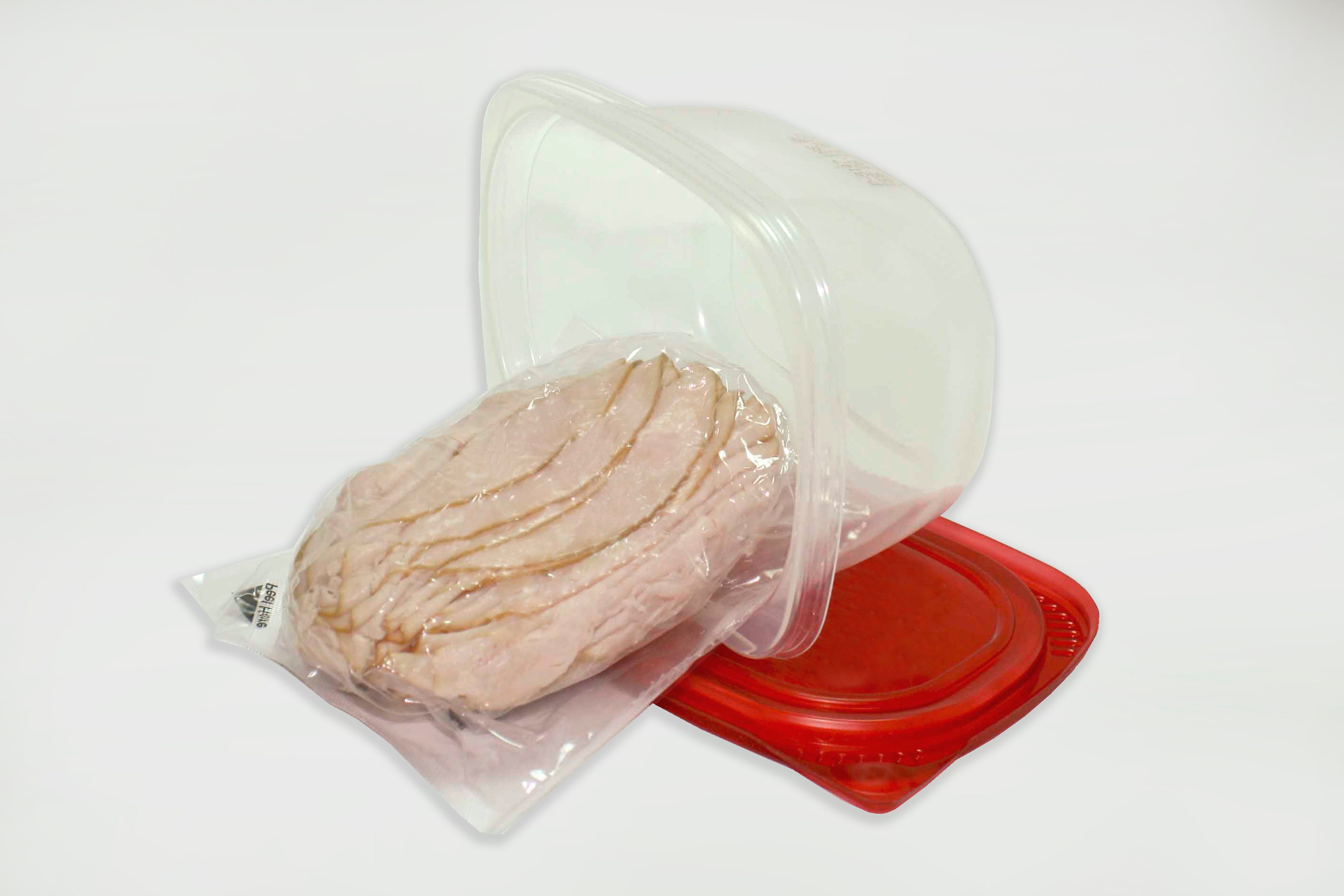 slices of meat in a vacuum-sealed bag in a plastic container
