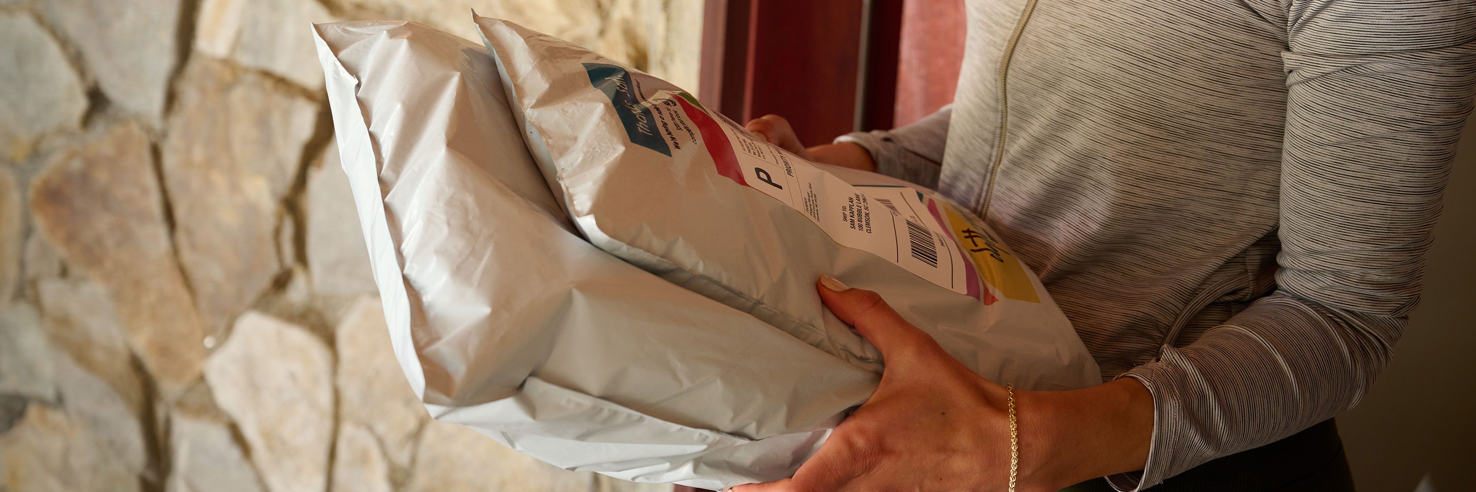 woman holding poly mailer