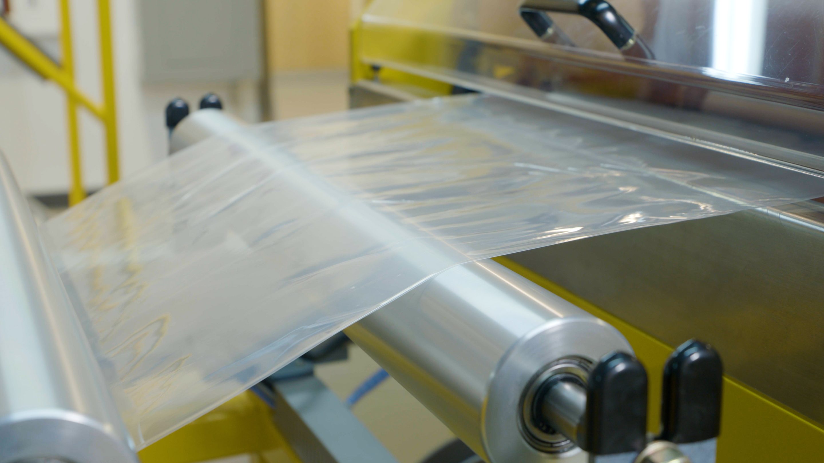 A film wrap roll being processed on a machine