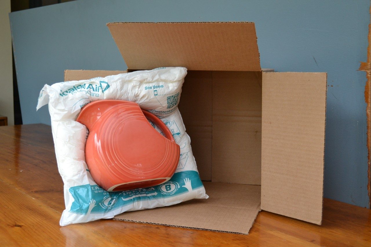 instapak pitcher in a cardboard box