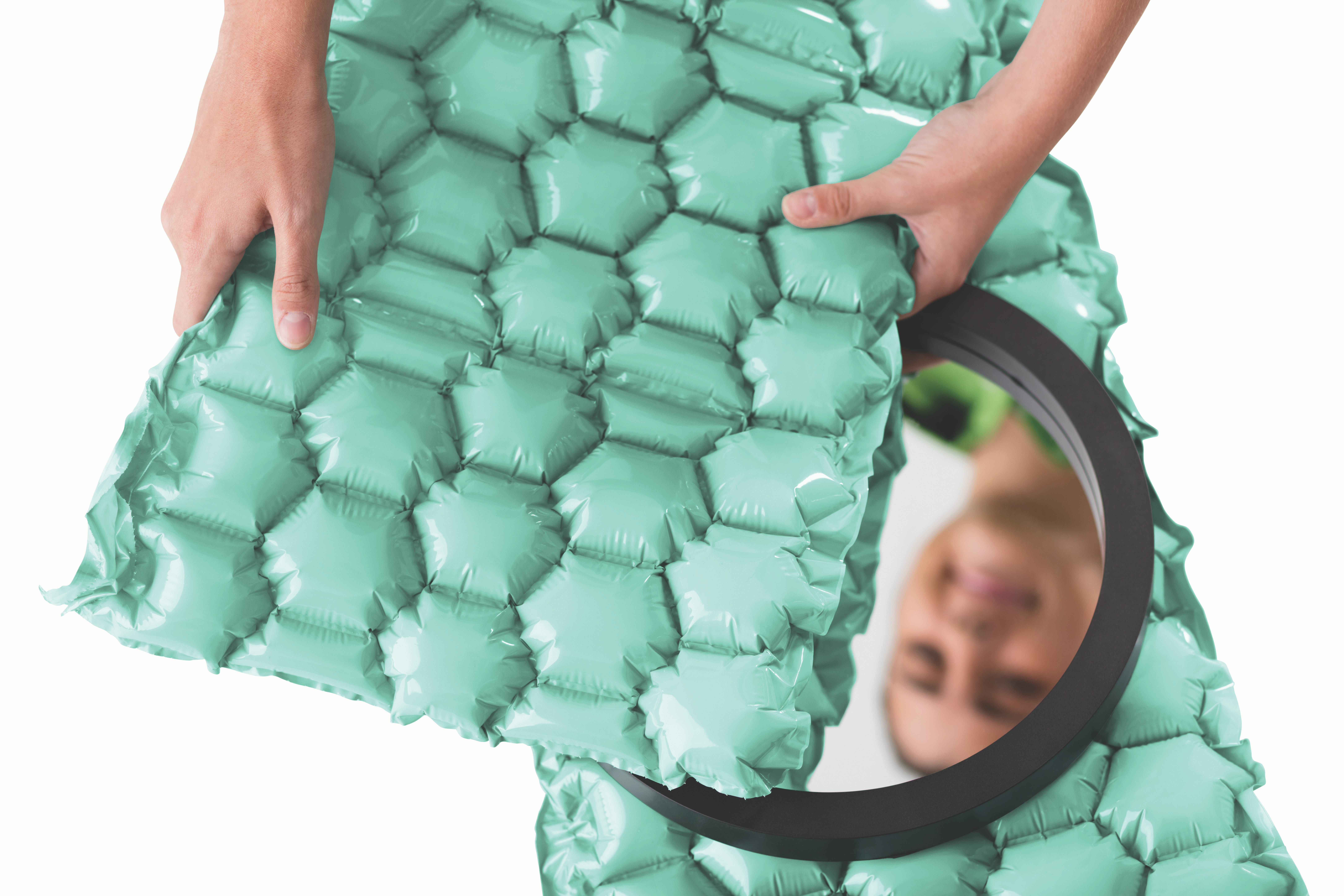 woman holding recycled inflatable cushioning