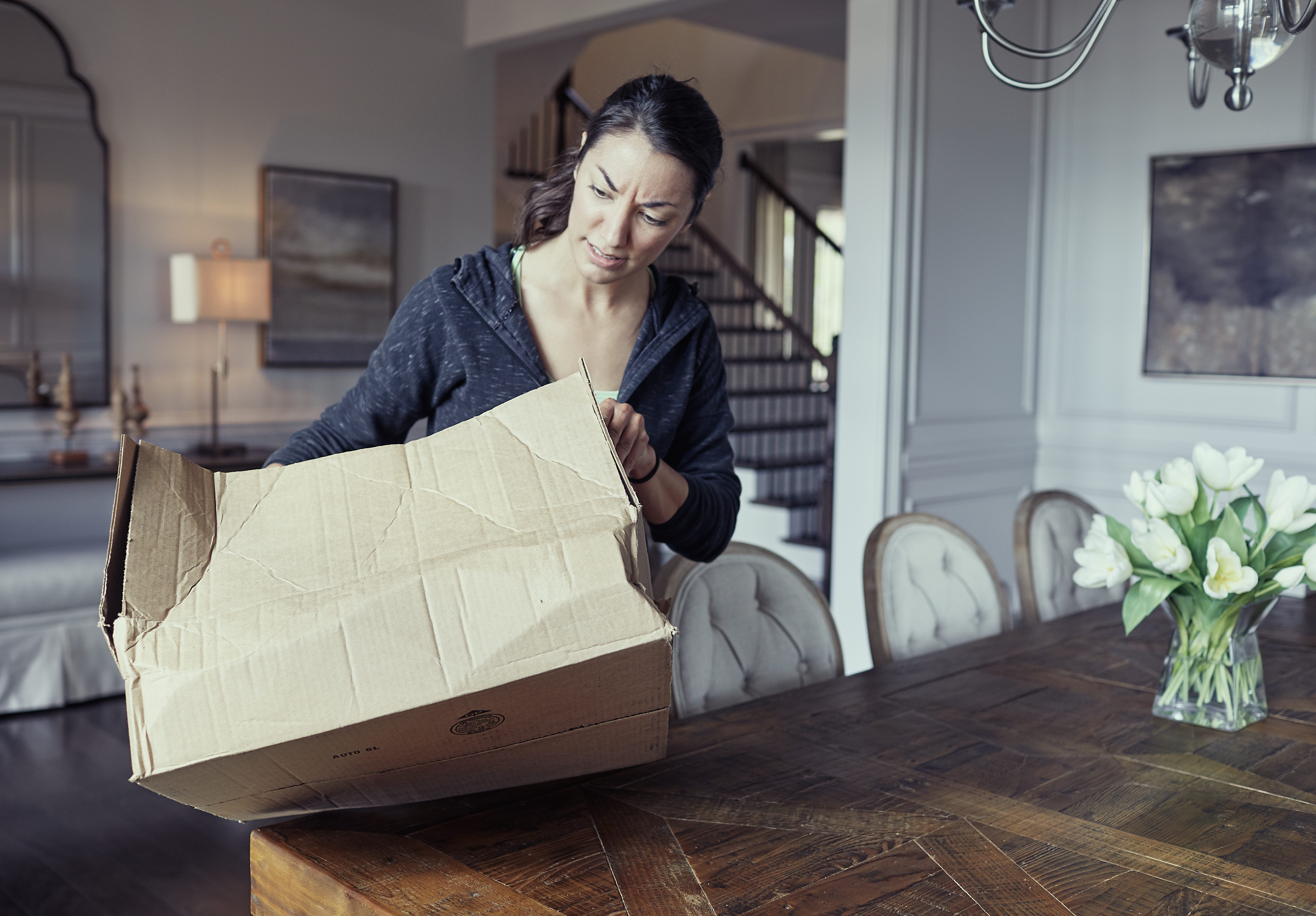 smashed package showing upset customer