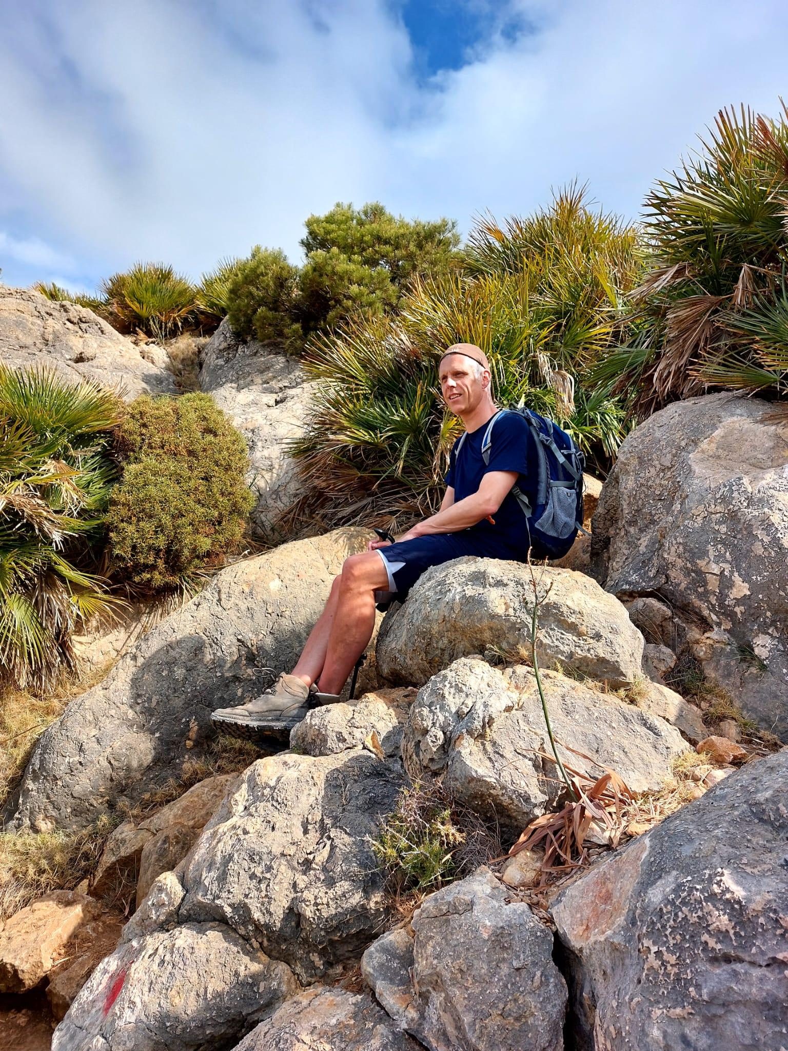 erik hansen sitting on a huge rocks