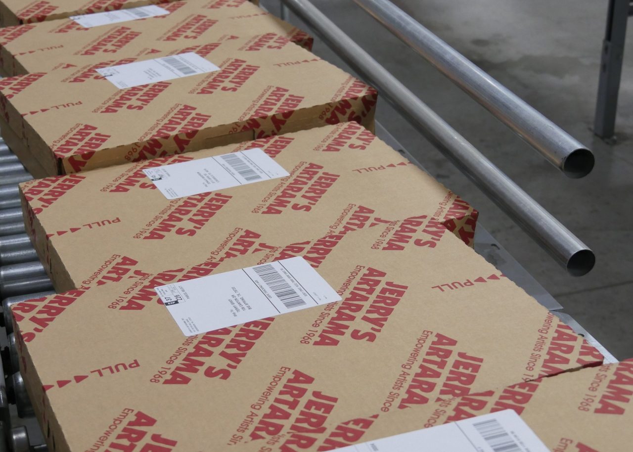 Jerry's Artarama packages on conveyor belt